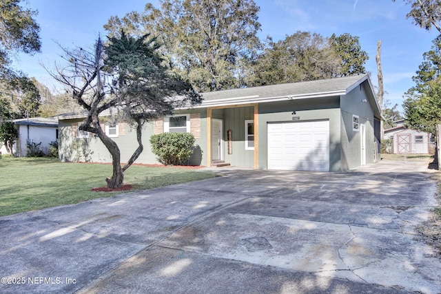 ranch-style home featuring a garage and a front yard