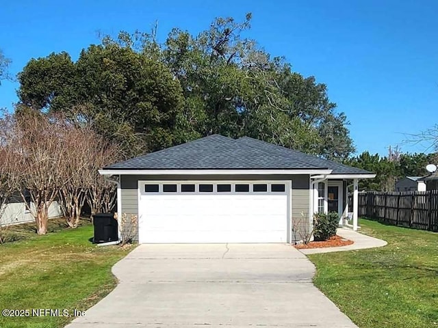 view of front of home with a garage and a front lawn