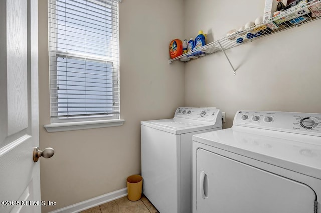 washroom with light tile patterned floors and independent washer and dryer