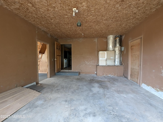 misc room with concrete flooring