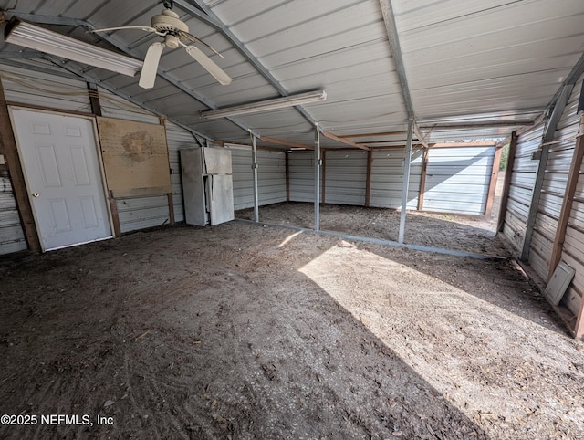 garage featuring white fridge and ceiling fan