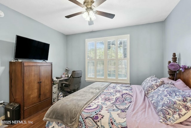 bedroom with ceiling fan and hardwood / wood-style floors