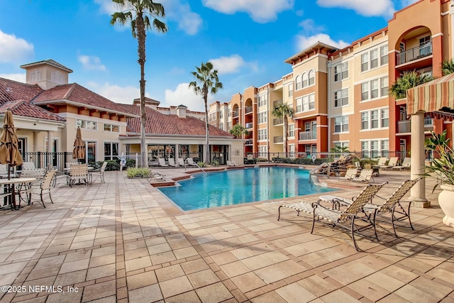 view of pool featuring a patio