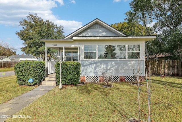 bungalow-style house with a front yard