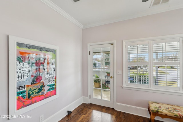 doorway featuring ornamental molding and dark wood-type flooring