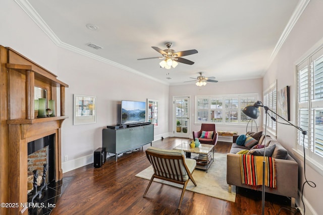 living room with dark wood-type flooring, a wealth of natural light, and ornamental molding