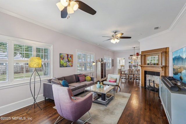 living room featuring ceiling fan, ornamental molding, and dark hardwood / wood-style flooring