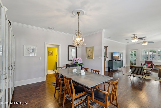 dining room with ceiling fan with notable chandelier, ornamental molding, and dark wood-type flooring