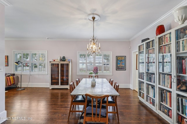 dining space with a notable chandelier, ornamental molding, and dark wood-type flooring