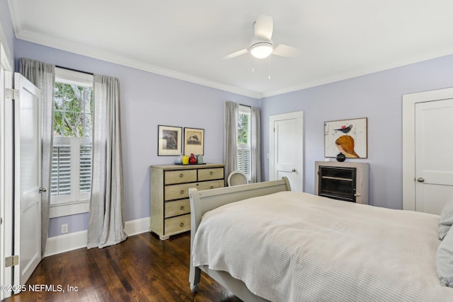 bedroom featuring ornamental molding, multiple windows, ceiling fan, and dark hardwood / wood-style flooring