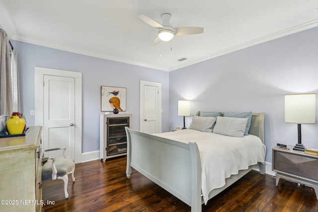 bedroom with ceiling fan, dark hardwood / wood-style floors, and ornamental molding