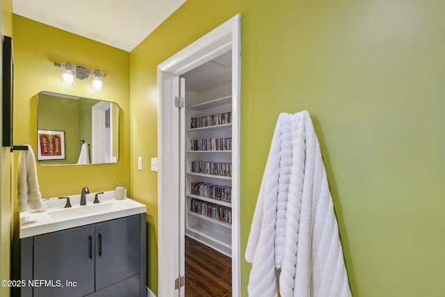 bathroom featuring hardwood / wood-style flooring and vanity