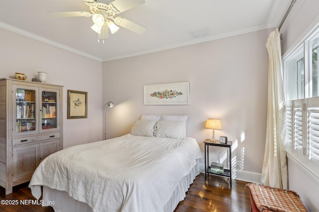 bedroom featuring ceiling fan, dark hardwood / wood-style flooring, and ornamental molding