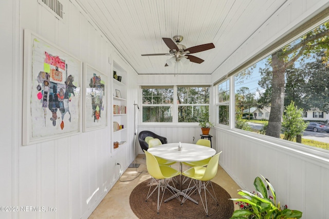 sunroom with wooden ceiling and ceiling fan