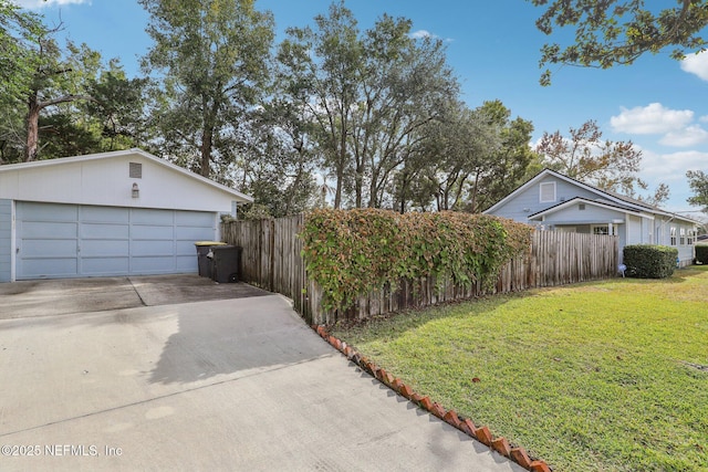 view of home's exterior featuring a garage and a yard