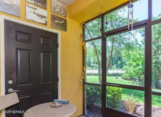 sunroom featuring a healthy amount of sunlight