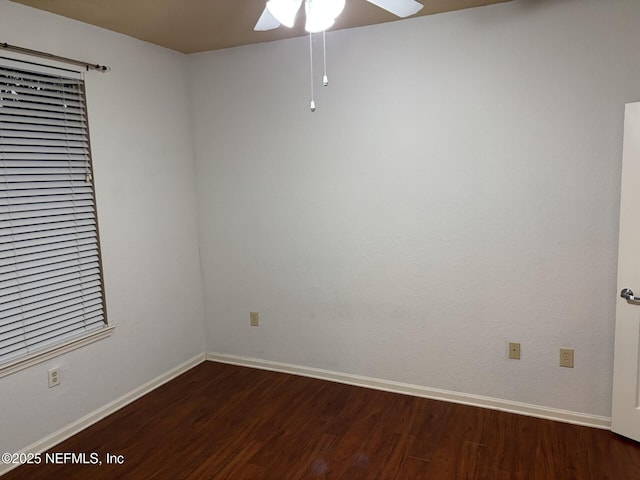 unfurnished room featuring ceiling fan and dark hardwood / wood-style flooring