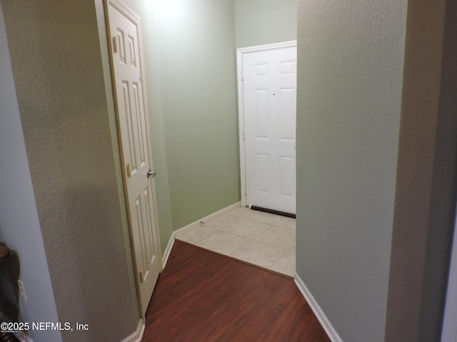 hallway with light wood-type flooring