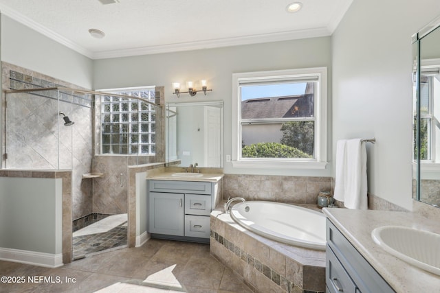 bathroom featuring vanity, ornamental molding, independent shower and bath, and a healthy amount of sunlight