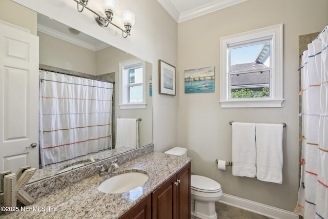 bathroom featuring vanity, ornamental molding, and toilet