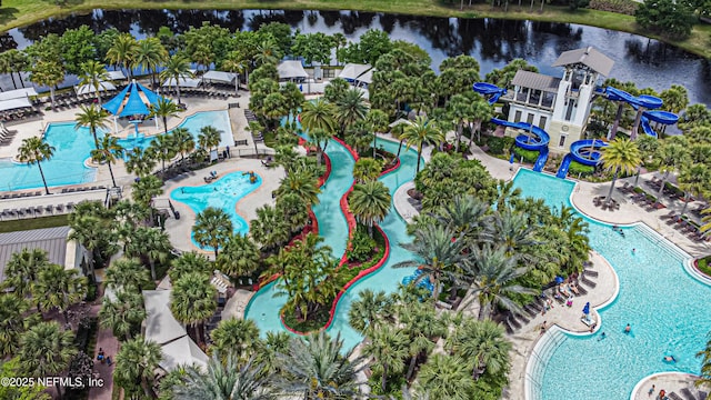 birds eye view of property with a water view