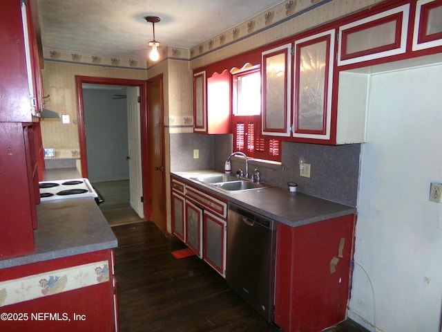 kitchen featuring dishwasher, decorative light fixtures, dark hardwood / wood-style flooring, tasteful backsplash, and sink