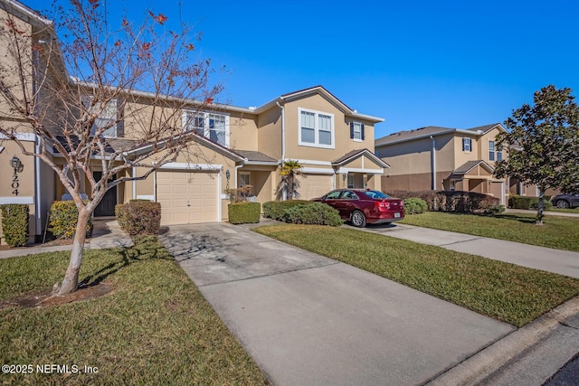 view of front of home with a garage and a front yard