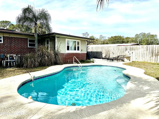 view of pool featuring a patio area