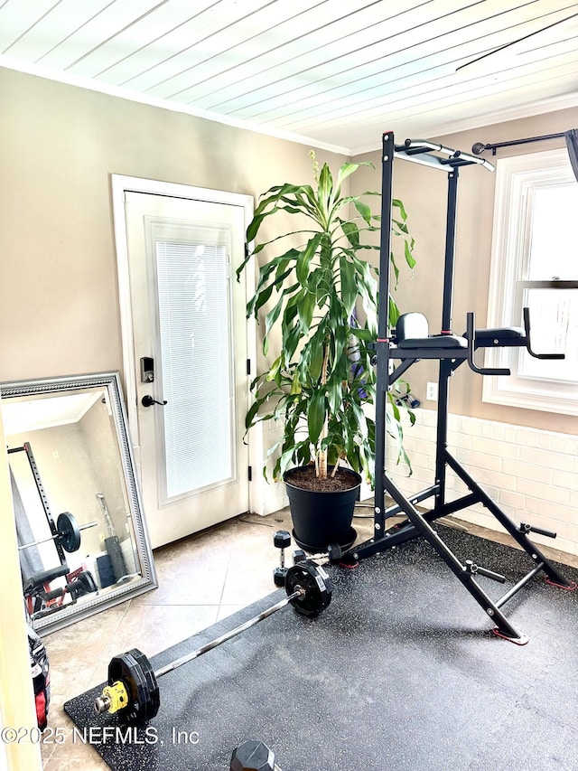 workout room with light tile patterned floors