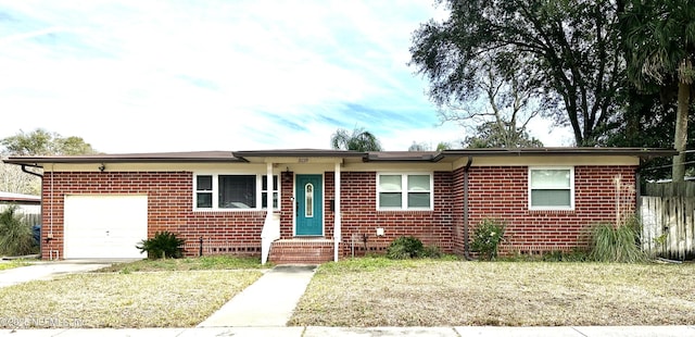 single story home with a front lawn and a garage