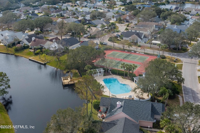 bird's eye view with a residential view and a water view