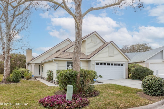 view of front of property featuring driveway, a front lawn, an attached garage, a shingled roof, and a chimney