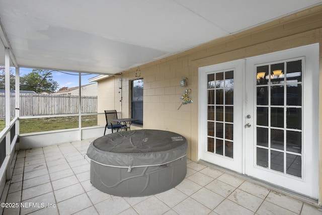 sunroom featuring french doors