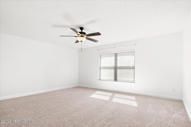 unfurnished room with baseboards, a textured ceiling, ceiling fan, and carpet flooring