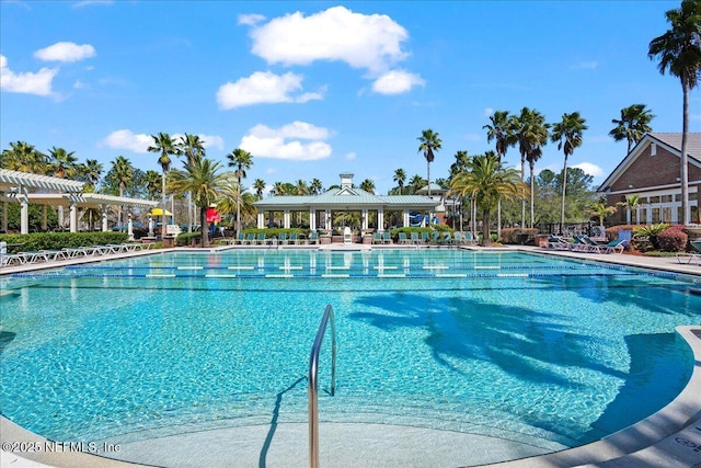 pool featuring a pergola and a patio