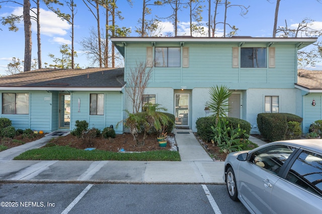 view of front of house with uncovered parking