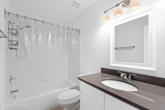 full bath featuring shower / bath combination with curtain, visible vents, vanity, and toilet