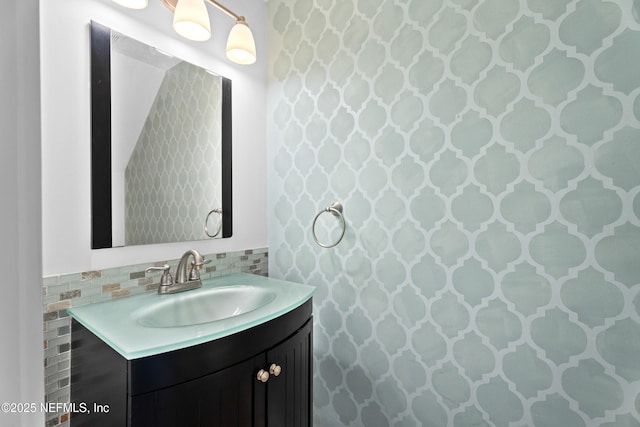 bathroom with vanity and decorative backsplash