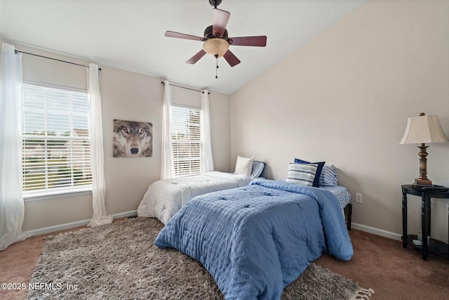 bedroom with carpet flooring, vaulted ceiling, and ceiling fan