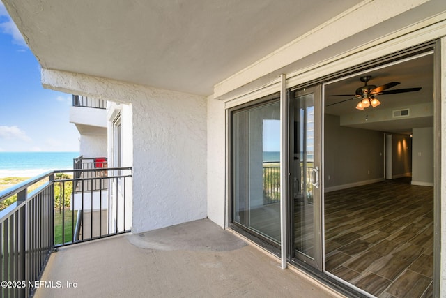 balcony featuring a water view