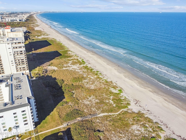 aerial view featuring a water view and a beach view