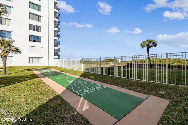 view of community featuring a lawn