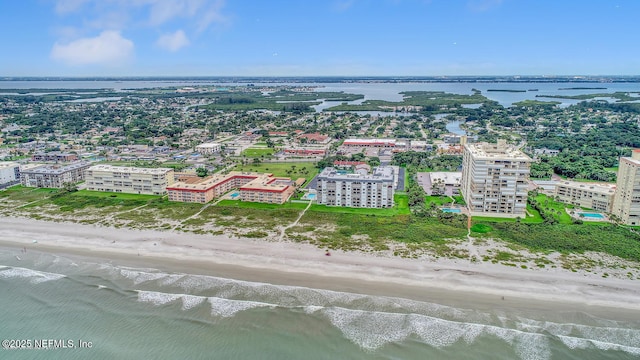 aerial view with a water view and a beach view