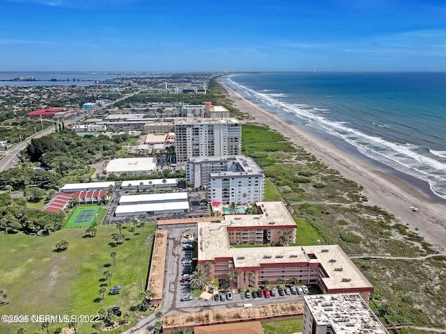 birds eye view of property featuring a view of the beach and a water view