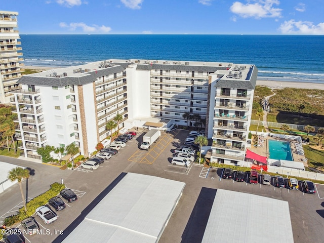 bird's eye view with a water view and a view of the beach