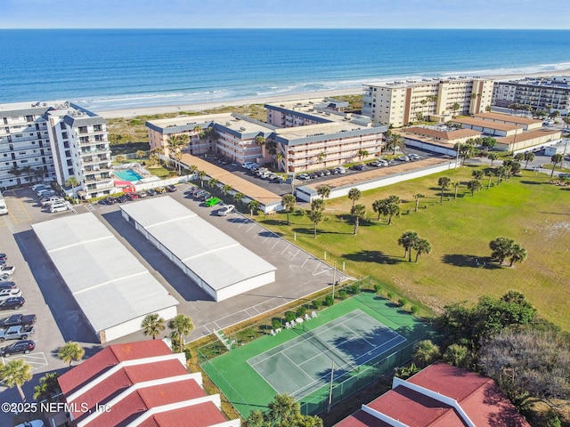 bird's eye view with a water view and a view of the beach