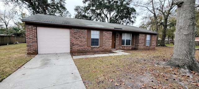 single story home with a garage and a front yard