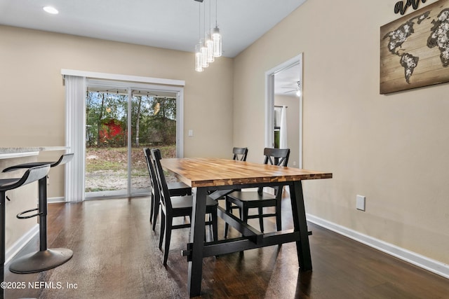 dining area with dark hardwood / wood-style floors