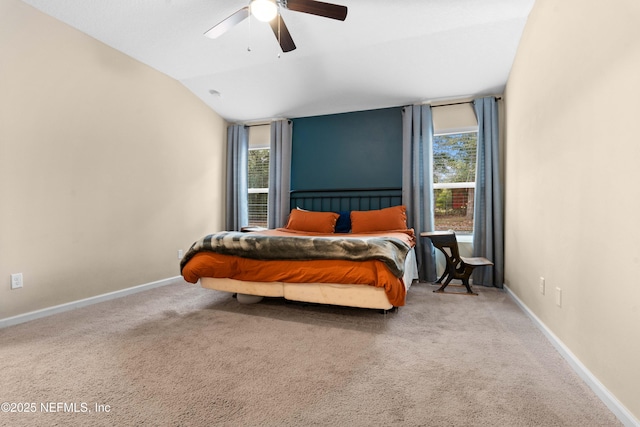 bedroom featuring ceiling fan, vaulted ceiling, and carpet floors