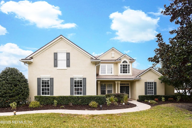 front facade featuring a front yard